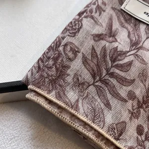 Close-up of vintage floral bird print cotton linen scarf showing fine mesh texture