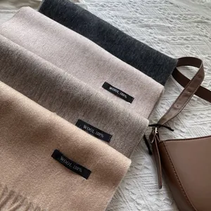Classic 100% wool tasseled scarves in autumn colors including grey, brown and camel tones