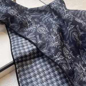 Detail of floral and houndstooth pattern on a vintage French-style cotton linen scarf