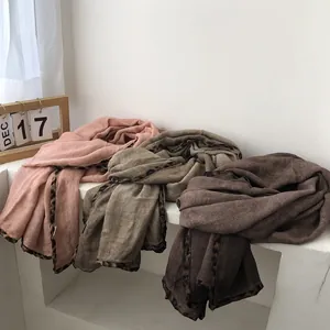 Three long cotton scarves in pink, olive green, and brown with stylish leopard print borders