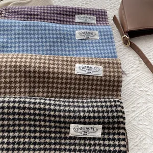 Classic houndstooth wool scarves in multiple colors for winter warmth and neck protection