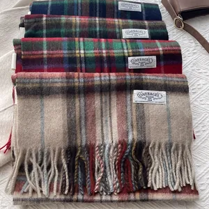 Classic soft wool plaid scarves with fringes and woven tags in multiple colors
