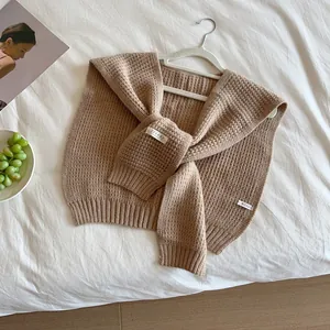 Milk tea beige waffle knit shawl wrap with Trendy logo for stylish layering outfit