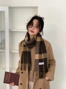 British style retro plaid cashmere scarf with fringes shown on a model with a wool coat