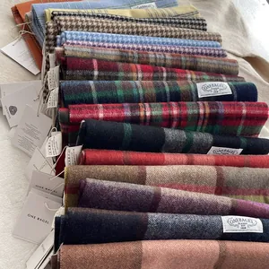 Classic 100% wool scarves in diverse patterns including plaid and herringbone