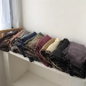 Selection of leopard-print trimmed knit scarves in assorted earth and Morandi tones