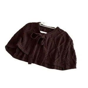 Dark brown knit shawl with cable patterns and a stylish ribbon tie closure for women