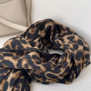 Close-up of leopard print scarf with vertical ribbed texture and soft knit fabric