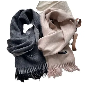 Minimalist 100% wool scarves in dark grey and beige with soft fringe and logo tag