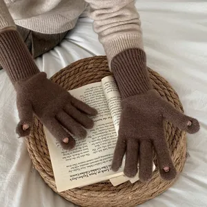Brown wool blend cable knit gloves with touchscreen fingertip openings and ribbed cuffs