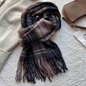 Classic vintage plaid scarf with navy and pink tassels paired with a wool coat and bag