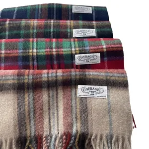 Classic plaid wool scarfs with tassel fringe in multiple winter colors and check patterns