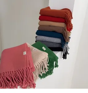Detailed collection of 100% pure wool scarves in 11 colors featuring long fringe tassels
