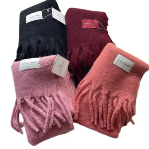 Soft tassel scarves in black, burgundy, and pink tones with premium woven texture