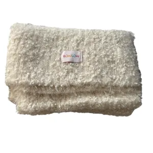 Cozy cream-colored teddy fleece scarf with BOWLOW logo tag for winter styling
