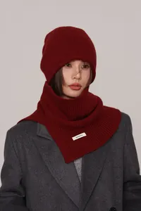 Detail of deep wine red 100% pure wool knitted hat and neck warmer set texture