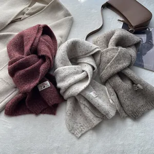 Wool blended knit scarves in burgundy, cream, and brown for winter warmth and style