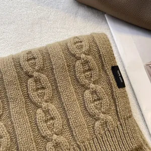 Macro shot of 100% pure wool scarf with luxury thick knit anchor chain texture