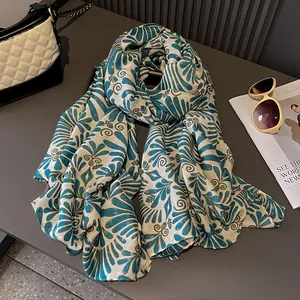 Teal and beige linen scarf with gold metallic threads and elegant floral wave patterns