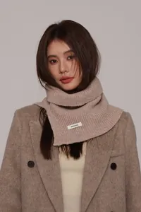 Detail of premium beige 100% wool ribbed knit neck warmer with thick texture