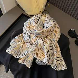 Elegant lightweight floral print scarf for beach and daily wear shown with fashion accessories