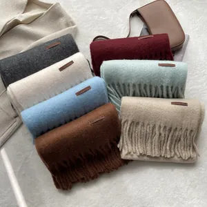 Thick solid color cashmere-like scarf collection with long tassels and leather labels