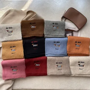 Cozy knit scarves with dog embroidery in various colors for winter fashion