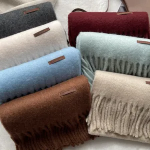 Winter wool cashmere scarf with long tassels and leather patch in multiple solid colors