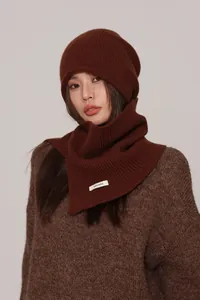 Detailed texture of dark brown 100% wool ribbed knit beanie and matching neck warmer