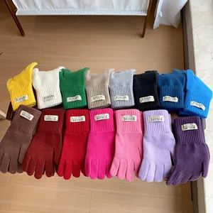 Thick knitted touchscreen gloves for women in multiple colors with ribbed cuffs
