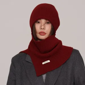 Oversized wine red wool balaclava with 100% wool label for minimalist winter style