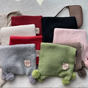 Sweet knit scarf for women in multiple colors with cute pom-pom details for winter warmth