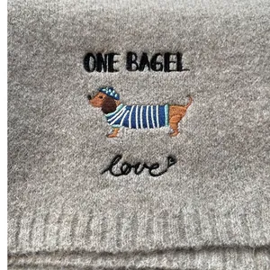 Knitted scarf with cute dachshund embroidery and One Bagel text in beige color