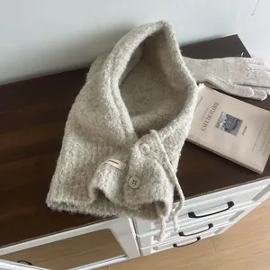 Women's knitted oat-colored balaclava hood and matching glove set for winter warmth