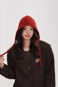 Close-up of reddish brown ribbed 100% wool knitted hood paired with a brown plaid blazer