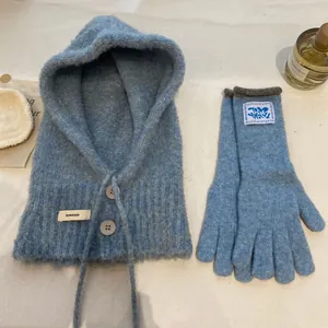 Blue knit balaclava hood with buttons and matching gloves for winter warmth