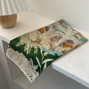 Elegant tropical palm leaf scarf in deep green and beige with vintage jungle patterns