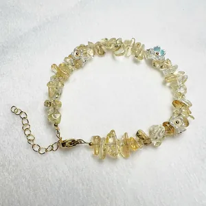 Handmade beaded bracelet with natural citrine chips and white floral charms with lobster clasp