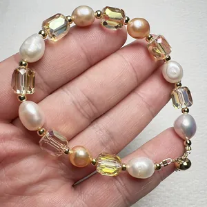 Close-up of baroque freshwater pearl bracelet with champagne crystals on a palm hand