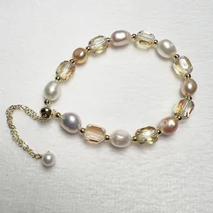 Detailed macro view of baroque freshwater pearls and champagne crystal beaded bracelet