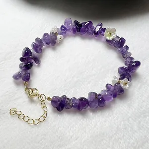 Natural raw amethyst beaded bracelet with delicate white flower charms and gold clasp