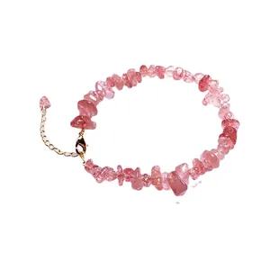 Pink strawberry crystal chip bracelet with gold lobster clasp and heart stone pendant