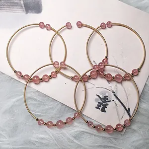 Five-piece strawberry quartz 14K gold filled wire wrapped bangles with pink beads