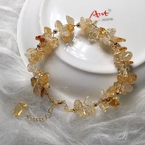 Detail of yellow citrine chip bracelet with 14K gold plated clasp and adjustable chain