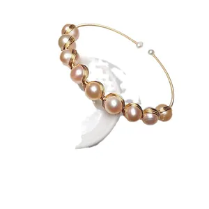 Handmade 14K gold wire wrapped bangle with elegant light pink freshwater pearls