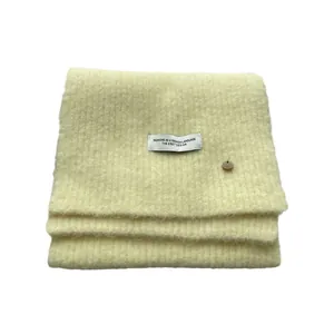 Creamy wool knit scarf for women featuring rib texture and decorative button