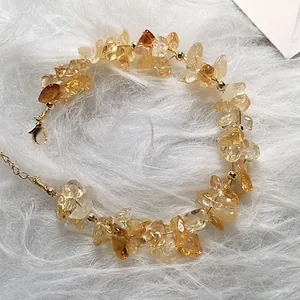 Handcrafted citrine beaded bracelet with 14K gold filled clasp on soft white fur