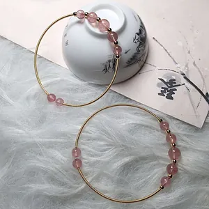 Pink strawberry quartz beaded bracelets with 14K gold-wrapped wire and spiral metal design
