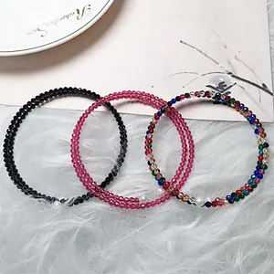Macro detail of double-layered spinel bracelets with faceted beads and a pearl accent