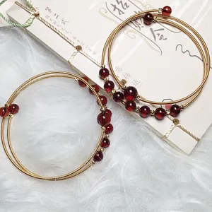Blood amber 14K gold wire wrapped multi-layer bracelet with red round garnet beads